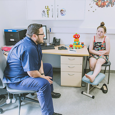 Doctor talking to young patient