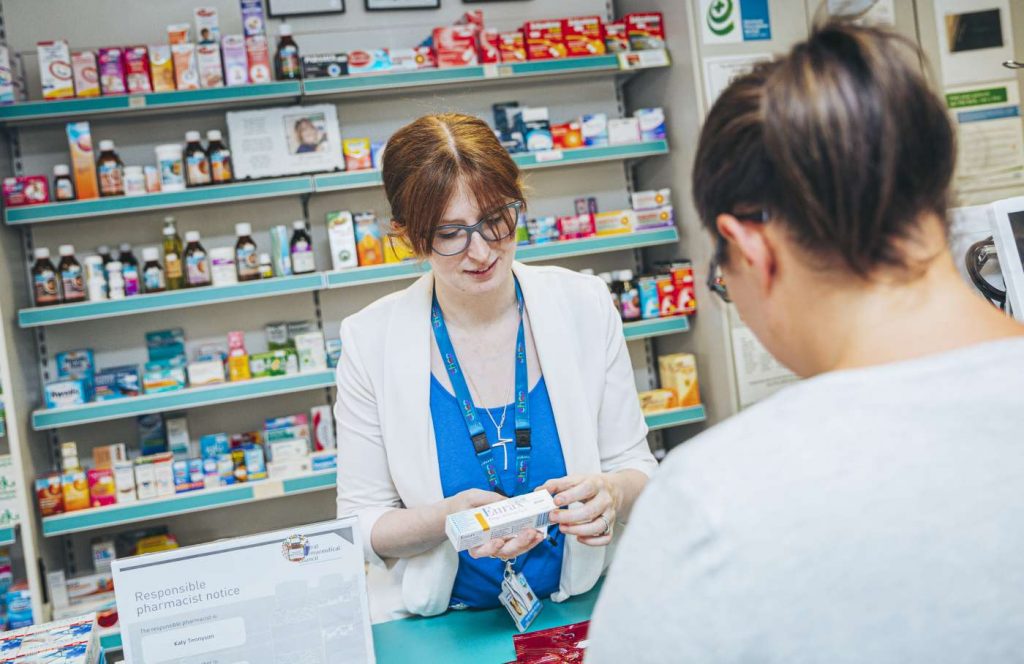 Pharmacist with customer